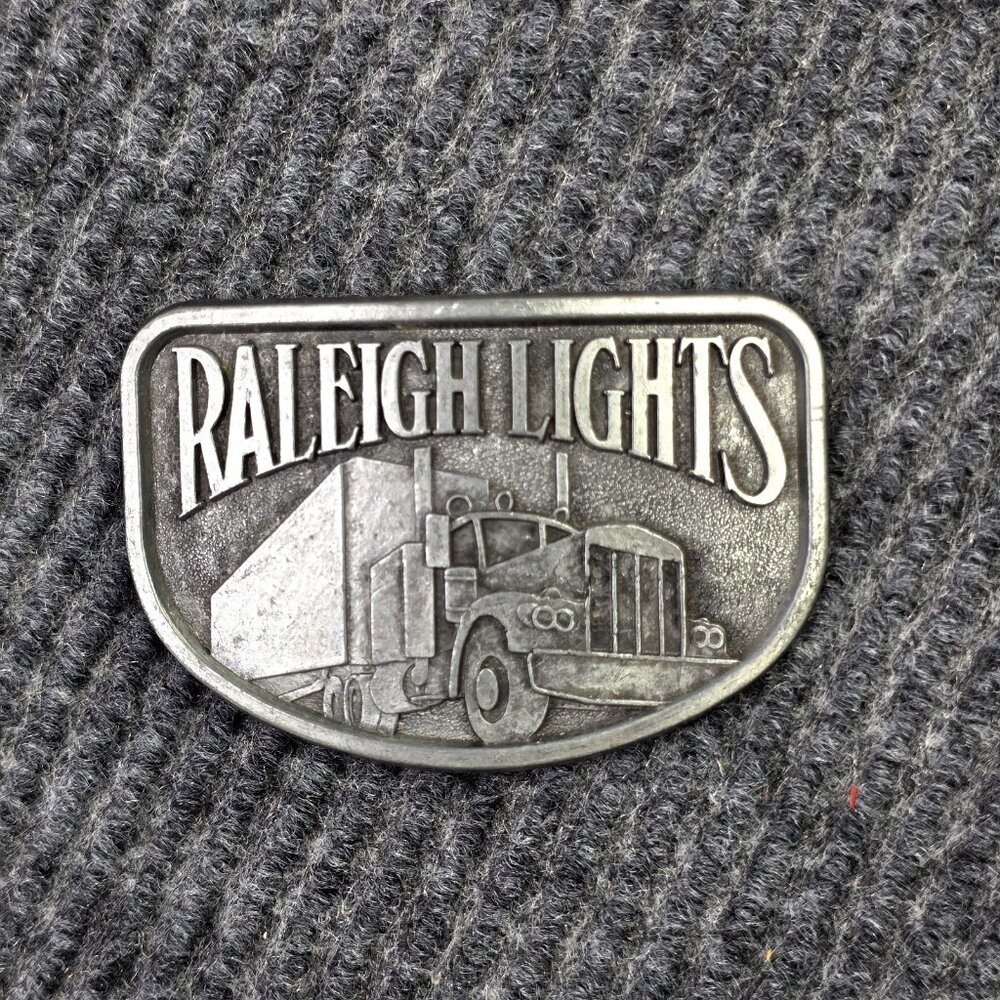 Vintage Raleigh Lights Belt Buckle Trucker Big Rig Tobacco Advertising Pewter